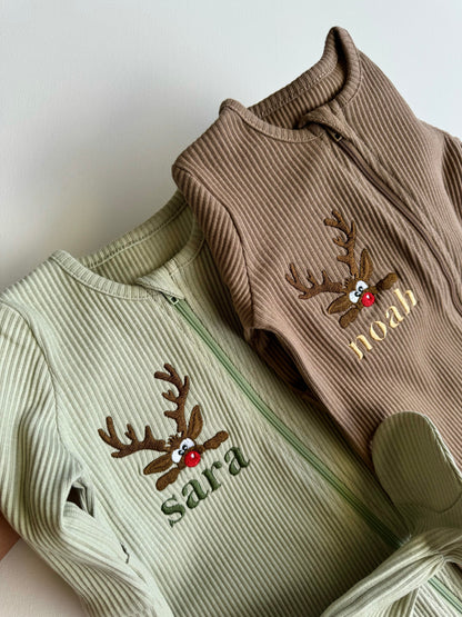 Variety of sizes for the Luxury Christmas Reindeer Sleepsuit by DreamBuy on a display, ideal for infants 0-36 months.