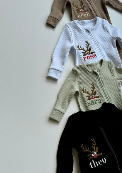 Close-up of the soft ribbed cotton fabric of the DreamBuy Christmas Reindeer Zip Sleepsuit for cozy winter comfort.