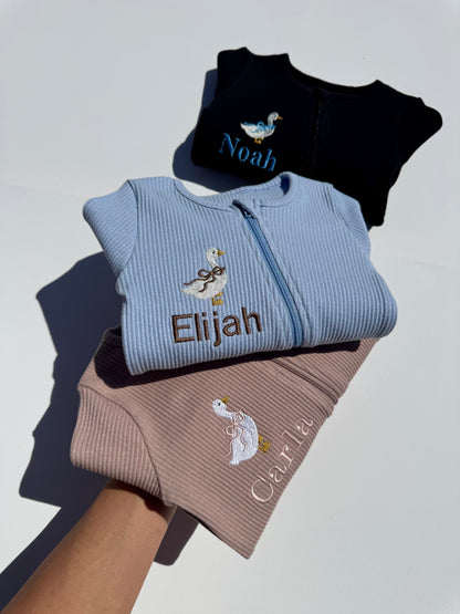 Luxury personalised goose-themed baby zip romper by DreamBuy, featuring exquisite safari animal embroidery, crafted from soft ribbed cotton for ultimate comfort.