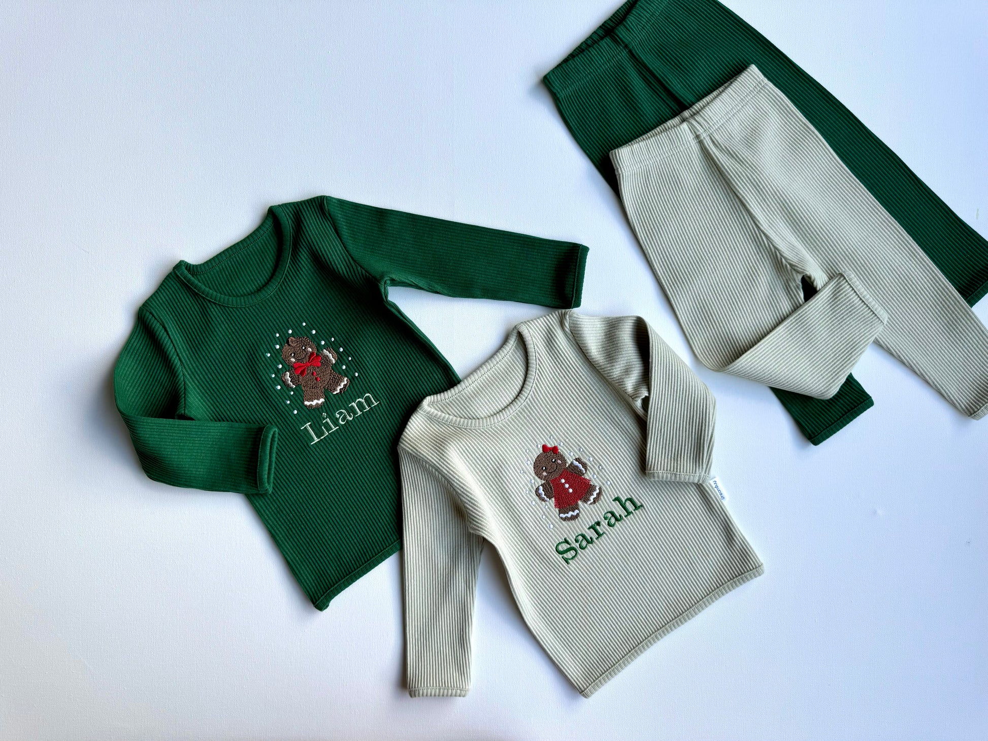 Elegant display of DreamBuy's Christmas Gingerbread Man Lounge Set for Adults and Kids, featuring intricate gingerbread prints and soft fabric.