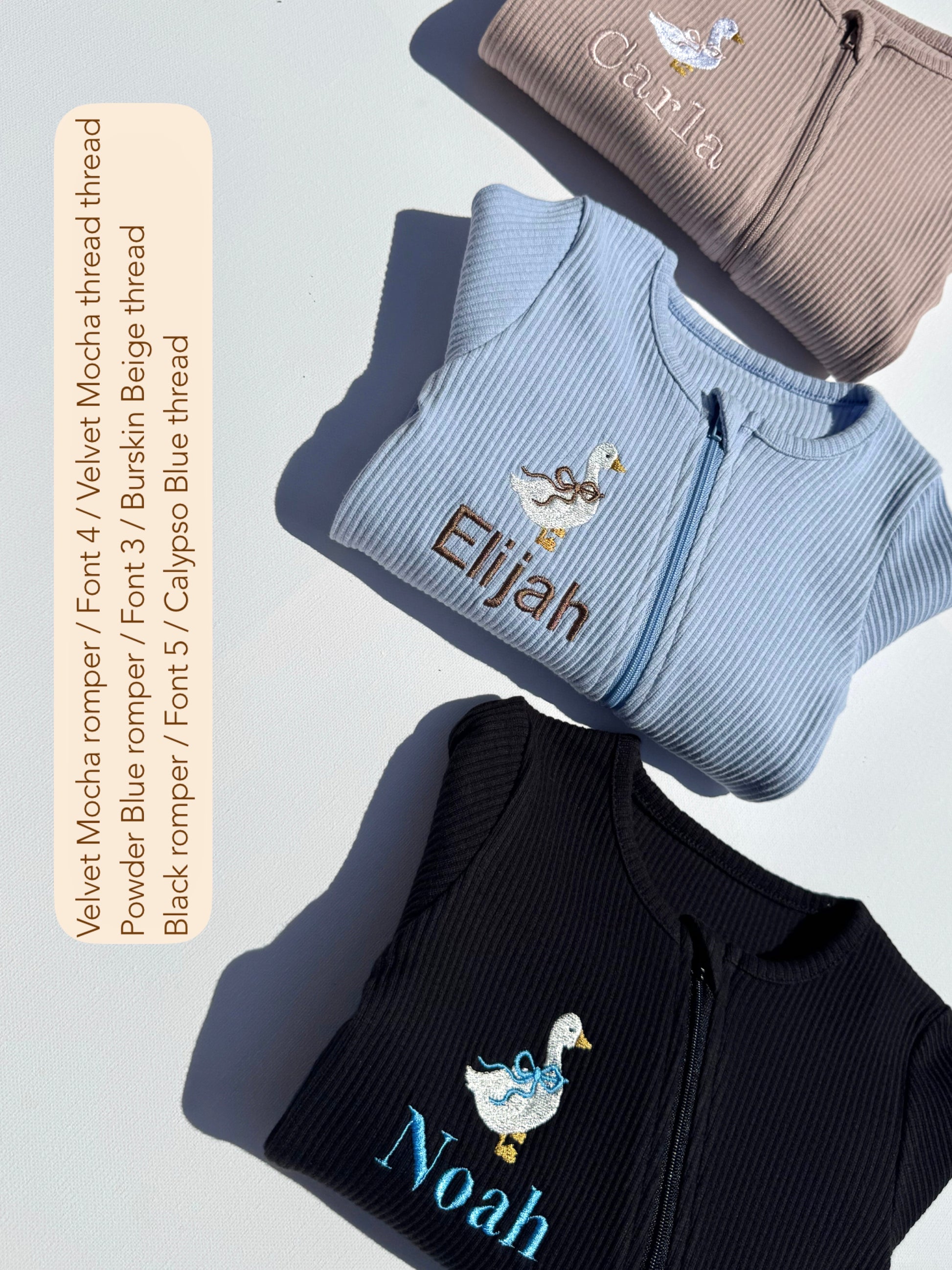 Luxurious personalised baby zip romper by DreamBuy featuring whimsical safari animal embroidery in soft cotton fabric.