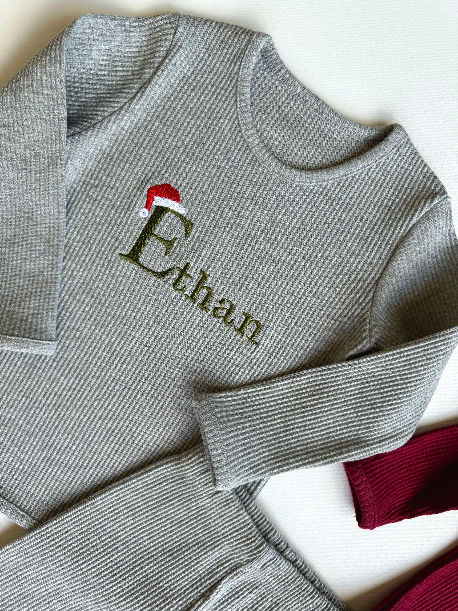 Cozy ribbed pajamas for the whole family from DreamBuy, showcasing personalized details for a unique holiday experience.