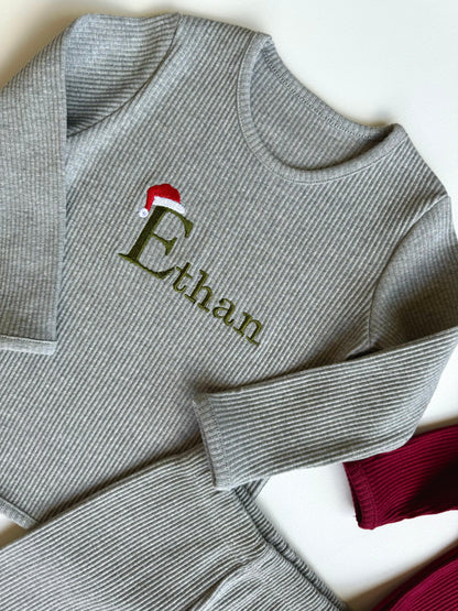 Cozy ribbed pajamas for the whole family from DreamBuy, showcasing personalized details for a unique holiday experience.