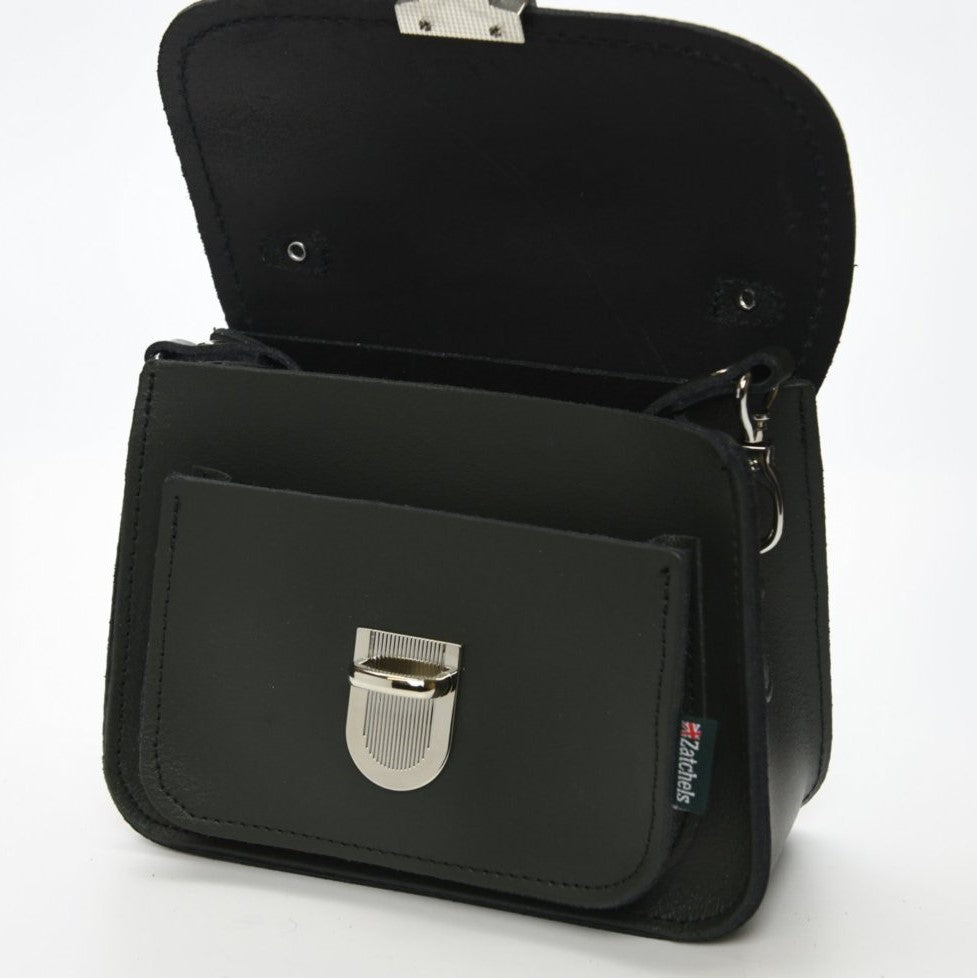 The Luna Handmade Leather Bag styled as a clutch, demonstrating its chic versatility and contemporary design, ideal for fashion-forward individuals.