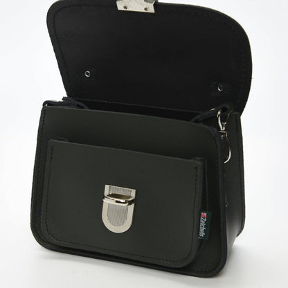 The Luna Handmade Leather Bag styled as a clutch, demonstrating its chic versatility and contemporary design, ideal for fashion-forward individuals.