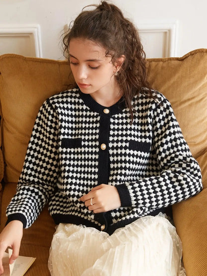 Chic and versatile Rita Women's Blouse in black and white checkered knitted fabric, designed by Dazzling Dreams Studio for a refined wardrobe.