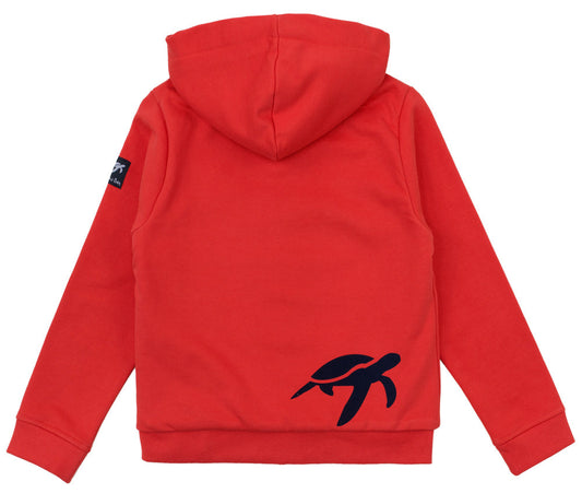 Close-up view of children's spicy red full zip hooded jacket, showcasing premium soft cotton fabric, ribbed cuffs, and signature embroidered Mullins turtle logo.