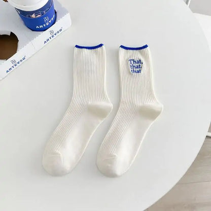 Elegant White Embroidered Socks for Women with Unique Japanese-Style Font Design adorned with blue cuffs, perfect for adding a stylish touch to any outfit.