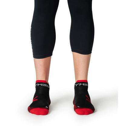 KYMIRA ankle socks in various sizes displayed elegantly, highlighting their cushioned heels and toes for superior comfort during workouts.