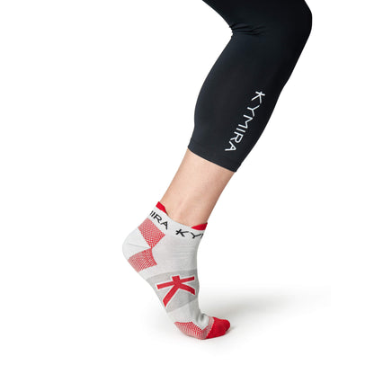 Luxury KYMIRA Infrared Ankle Socks featuring ribbed cuffs and anti-rub tabs for enhanced comfort and durability during workouts.