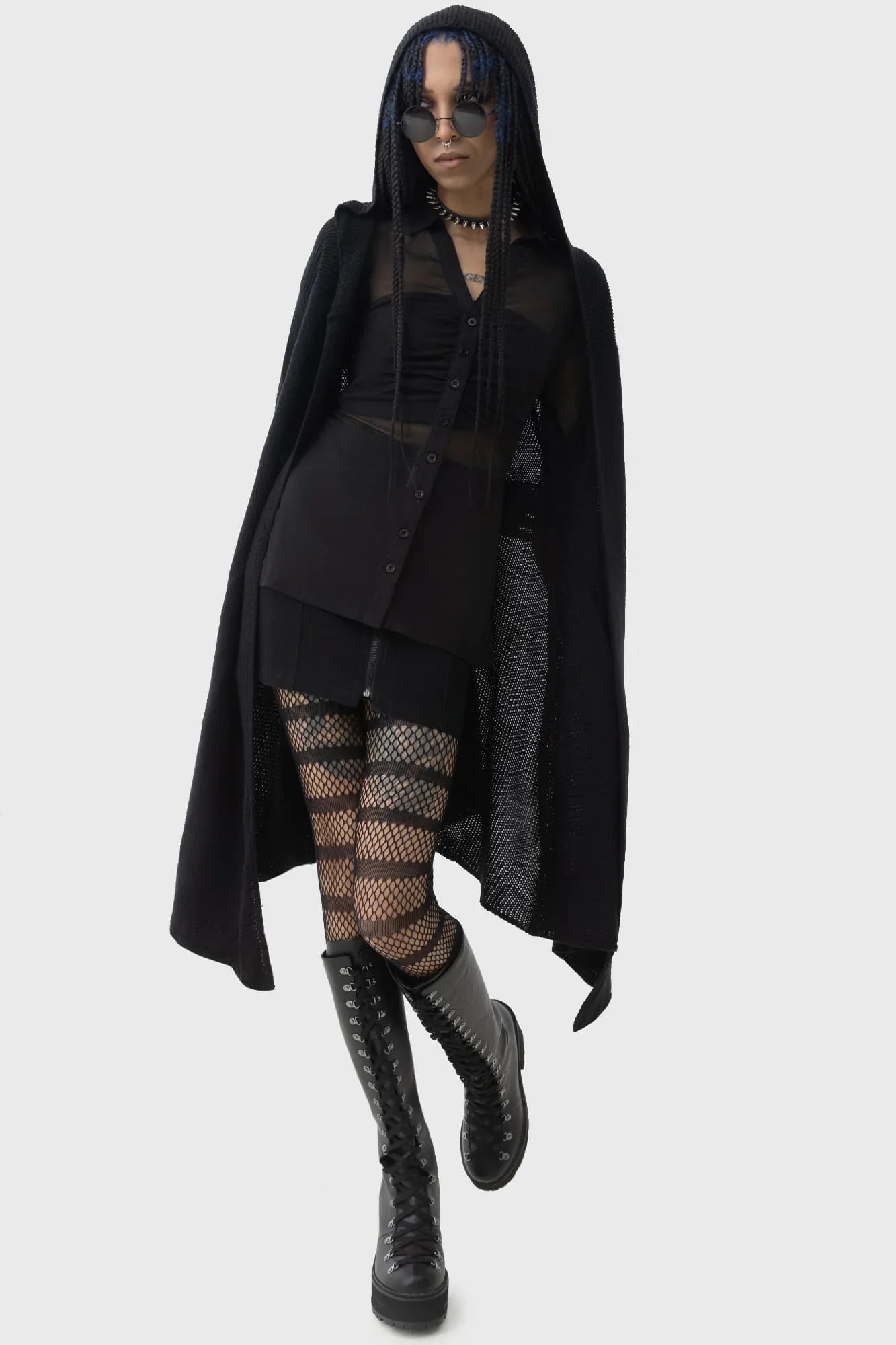 The stylish dip hem detail of the Killstar Last Quarter Hooded Cardigan, illustrating its flowy silhouette and dramatic design.