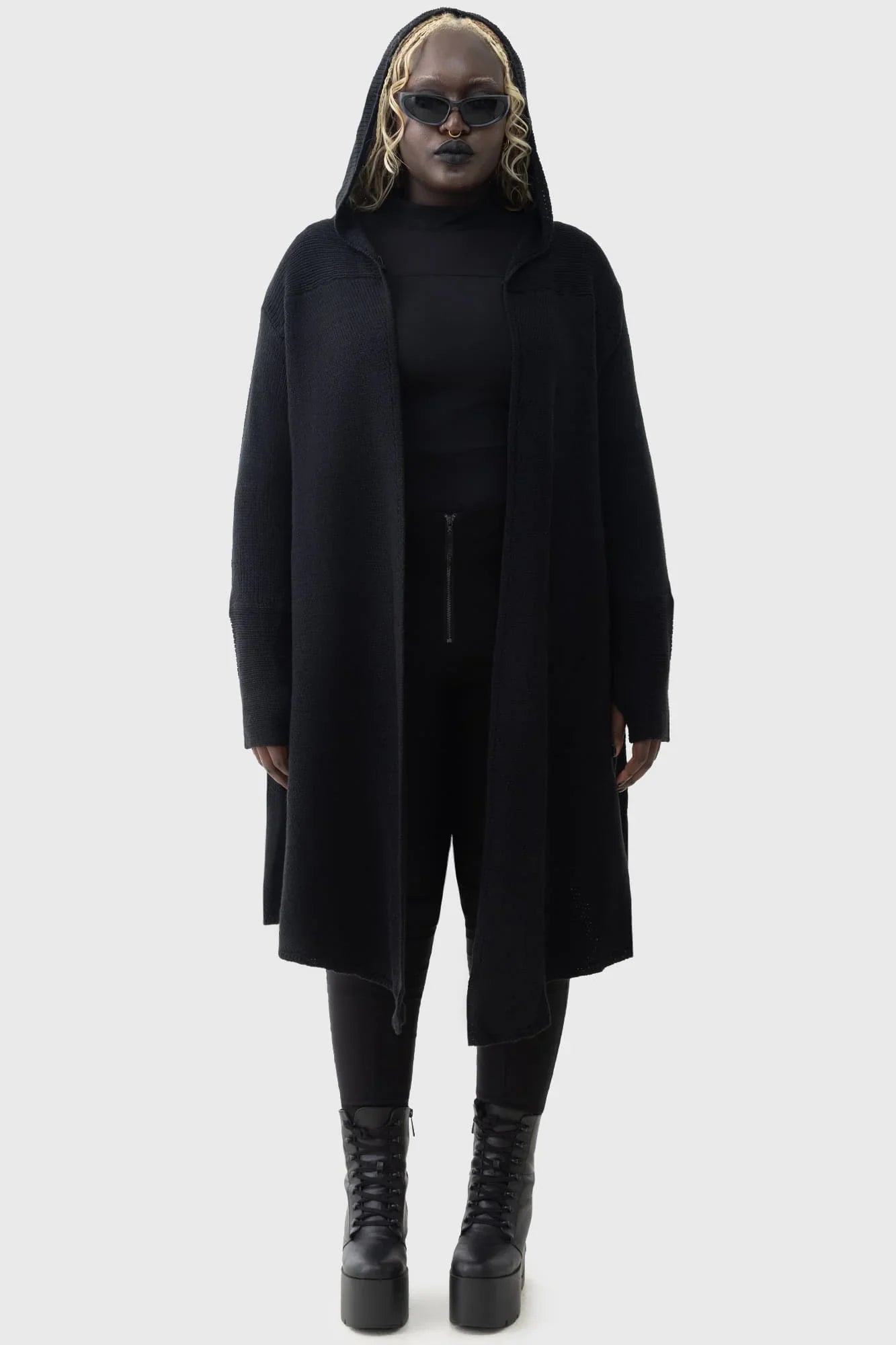 Model wearing the Killstar Last Quarter Hooded Cardigan, styled with dark, enchanting outfits, highlighting its versatile dramatic silhouette.