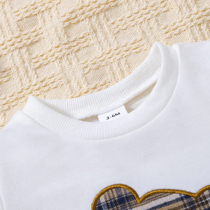 Baby wearing the Baby Bear Graphic Set by Dazzling Dreams Studio, demonstrating the outfit's perfect fit and charming style in a playful setting.
