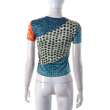 Close-up of the exquisite print on the Sweet Legend Women's Cropped Tee by Dazzling Dreams Studio, featuring intricate designs and luxurious fabric.