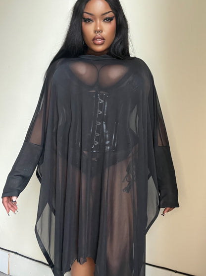 Close-up view of the delicate mesh texture of the Necessary Evil Anahita Dress, highlighting its UK craftsmanship and versatile layering potential.