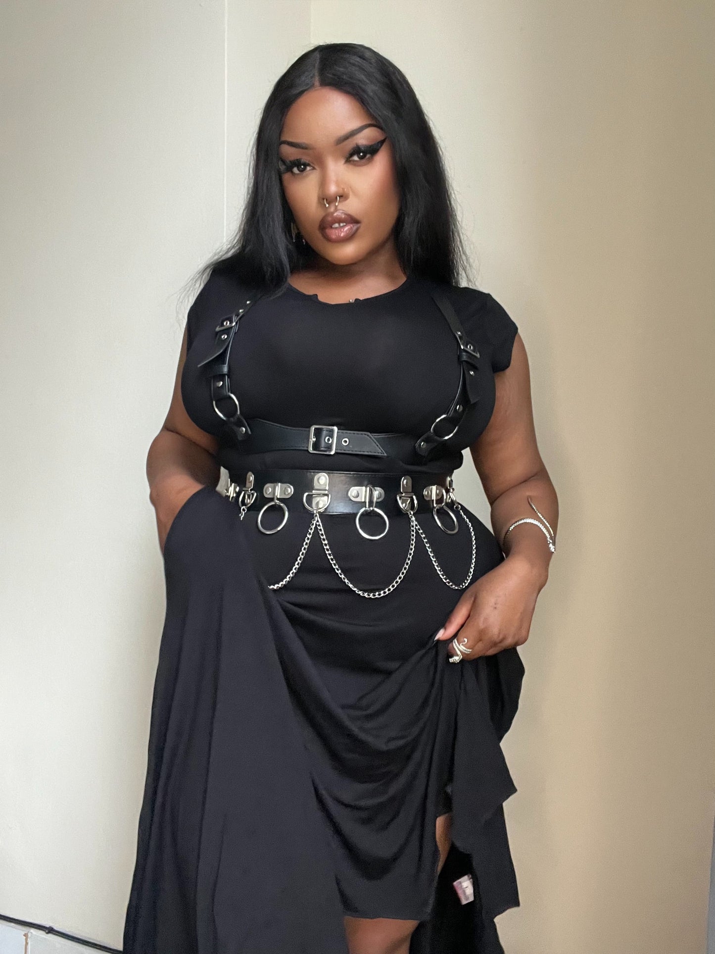 Elevate your gothic style with the Necessary Evil Evaki Hi-Low Dress featuring a dramatic bat wing hem, in soft stretch viscose jersey, showcasing its elegance and practicality with pockets.