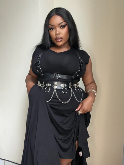 Elevate your gothic style with the Necessary Evil Evaki Hi-Low Dress featuring a dramatic bat wing hem, in soft stretch viscose jersey, showcasing its elegance and practicality with pockets.