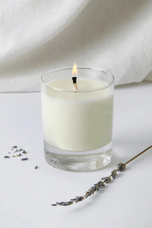 Elegant Lavender Essential Oil Soy Wax Votive Candle, hand-poured in a stylish glass jar for luxury relaxation.