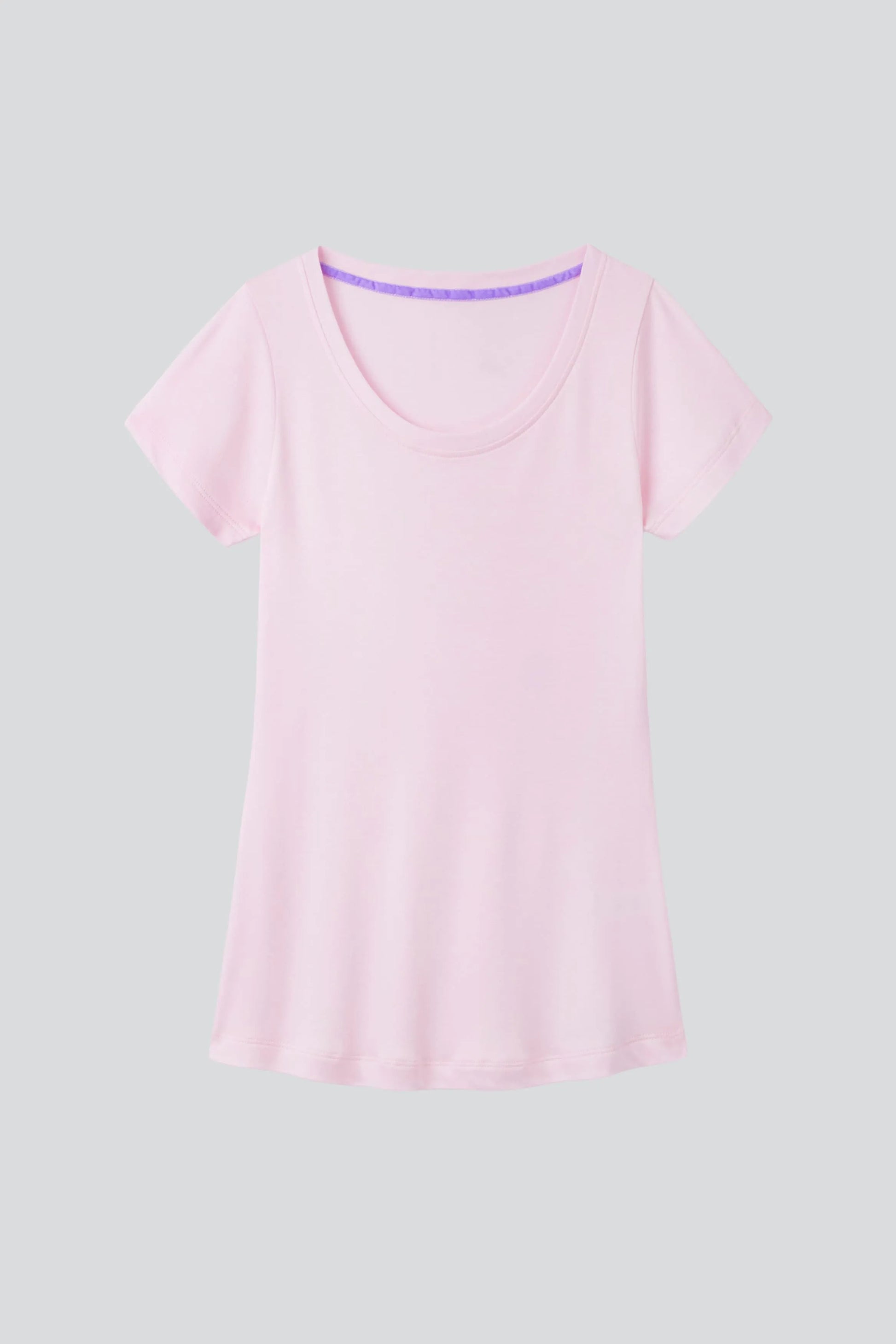 A neatly folded women's scoop neck cotton modal blend t-shirt in a chic setting, reflecting a timeless wardrobe essential suitable for any occasion.
