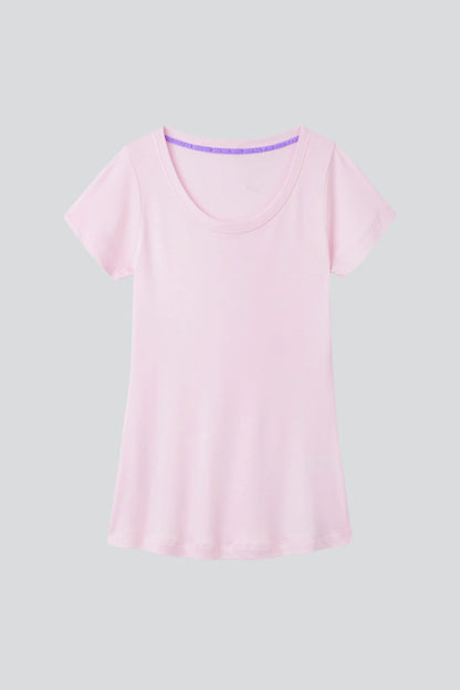 A neatly folded women's scoop neck cotton modal blend t-shirt in a chic setting, reflecting a timeless wardrobe essential suitable for any occasion.