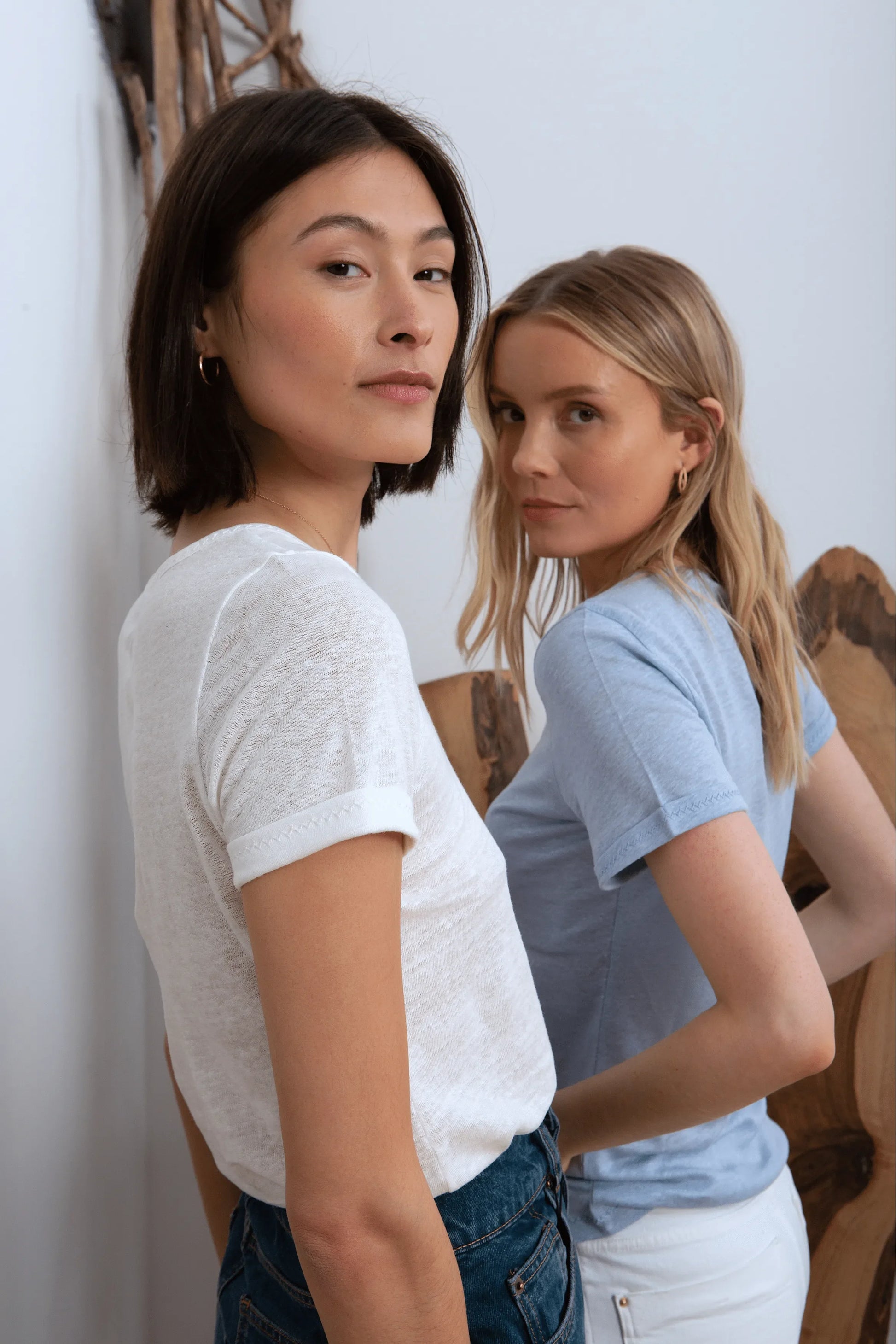 Luxury women's 100% linen t-shirt displayed elegantly on a model, showcasing its breathable and lightweight fabric for summer style.
