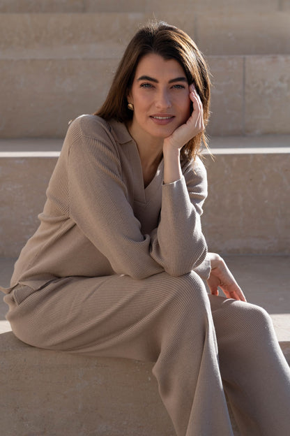 Detail of the deep V neckline and dropped shoulder design on the luxurious lounge jumper, combining comfort with sophistication.