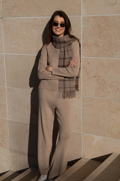 Luxury ribbed wide-leg loungewear trousers made from soft Pima cotton and baby alpaca, displayed elegantly in a soft, natural light.
