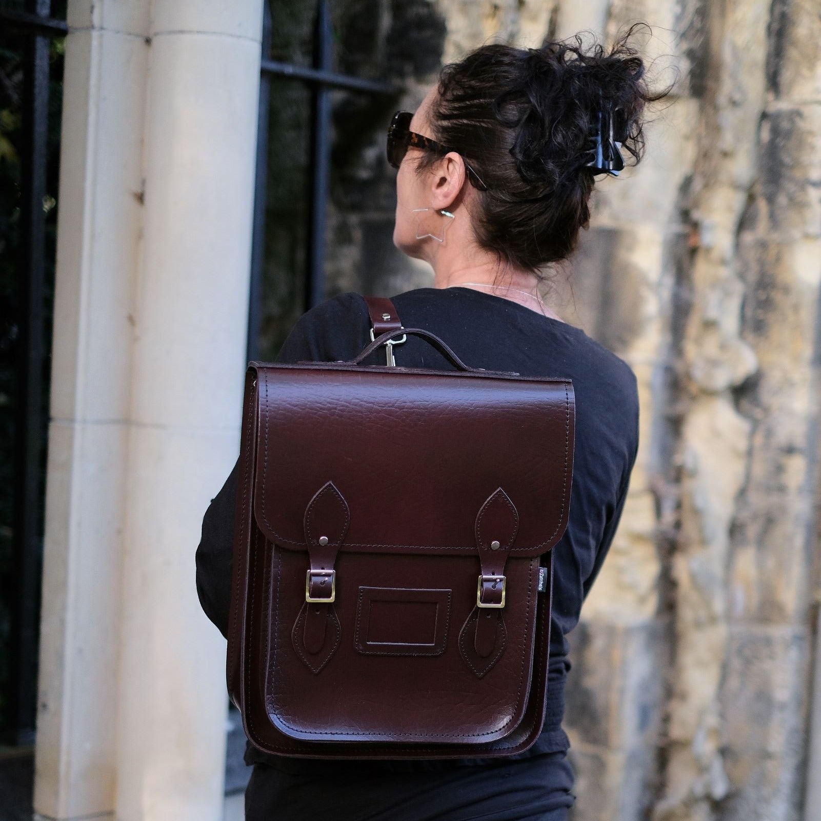 Luxury Handmade Leather City Backpack in Marsala Red, showcasing high-quality Scottish leather, designed for tablets and laptops up to 13 inches, featuring silver nickel buckles and a sophisticated design suitable for modern urban explorers.