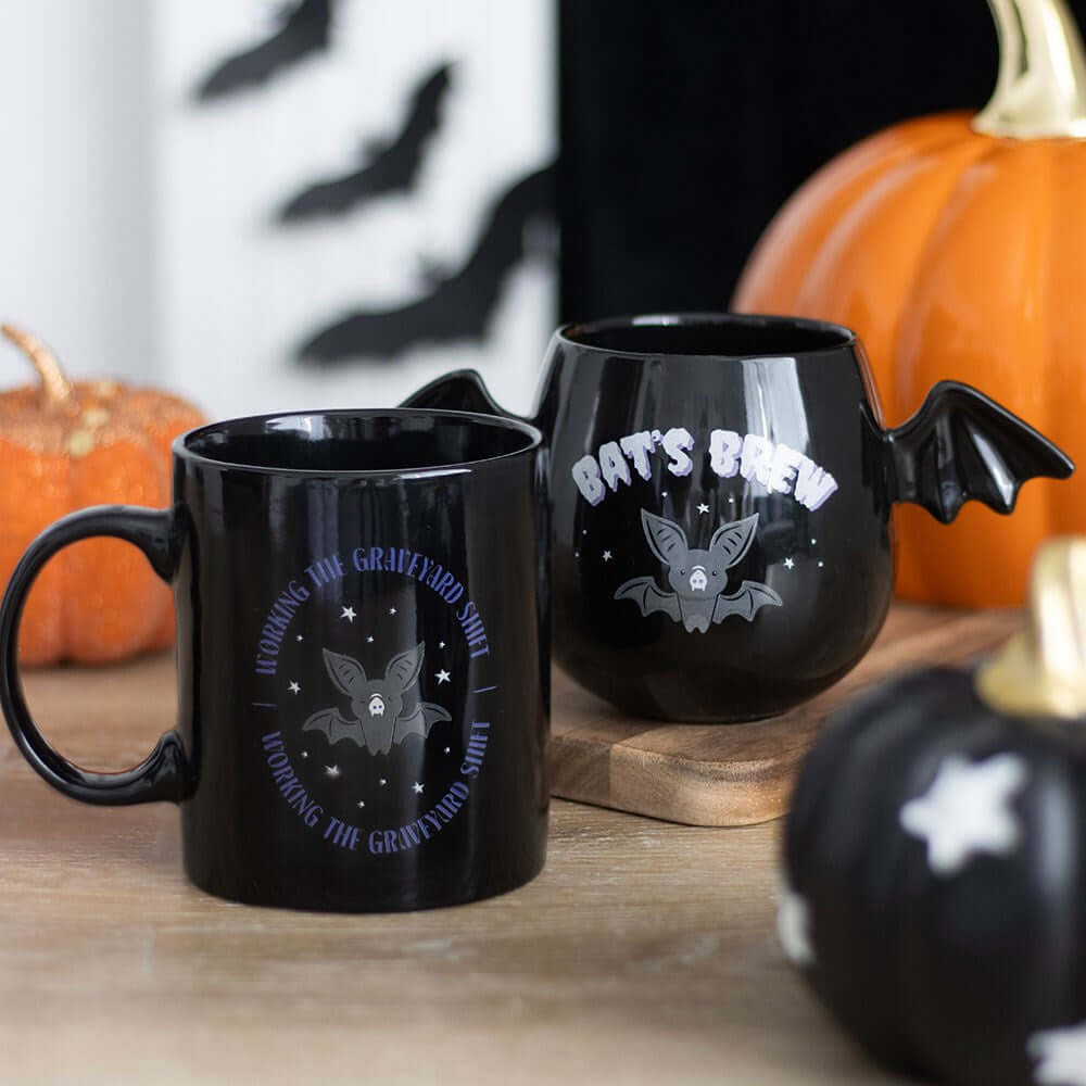 Lifestyle shot featuring the Gothic Bat Wing Mug in use, showcasing its charming gothic style while sipping coffee, ideal for luxurious mornings.