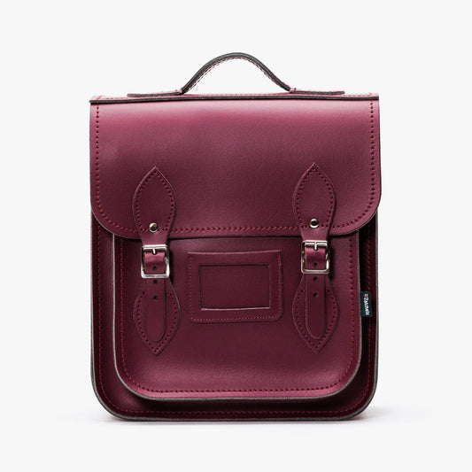Handmade Marsala Red Leather City Backpack by Zatchels, showcasing exquisite British craftsmanship, luxurious design, and stylish silver nickel buckles, perfect for tablets up to 13 inches.