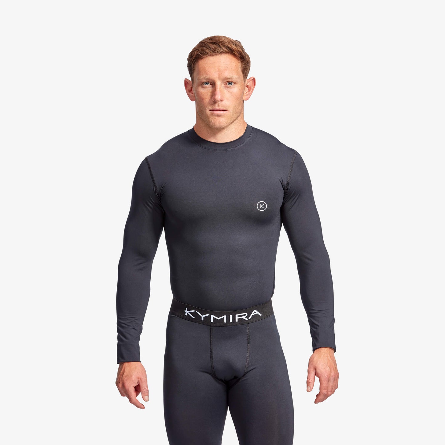 KYMIRA Men's IR50 Infrared Recovery Long Sleeve Performance Top model showcasing supportive fit and breathable, quick-drying fabric, designed for luxury athletic wear.