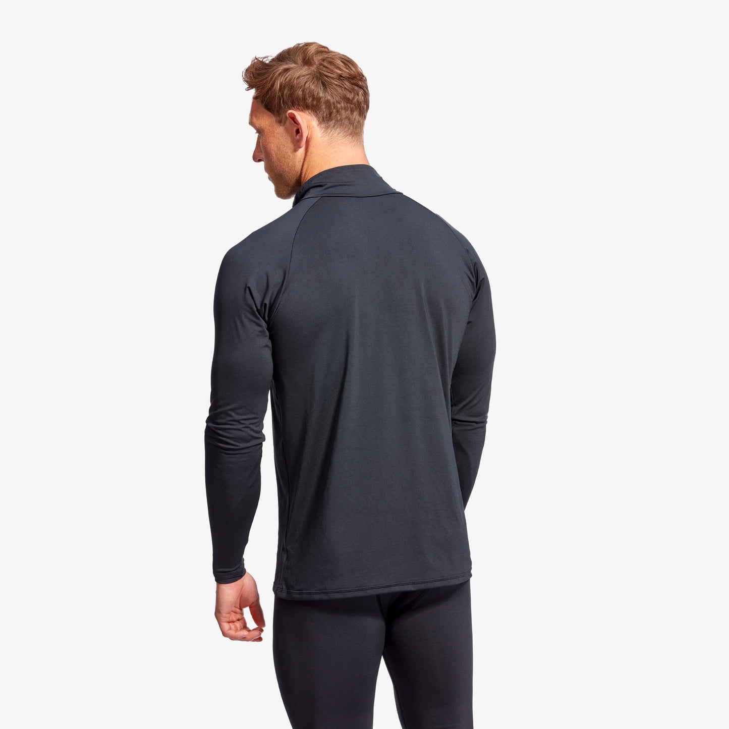 KYMIRA Men's Infrared 1/4 Zip Long Sleeve Top in dynamic action shot, demonstrating optimal flexibility and breathability for athletic pursuits.