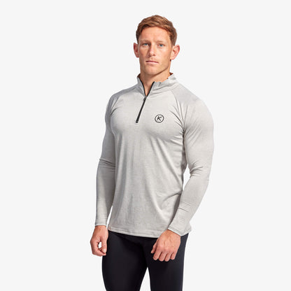 Detailed view of the KYMIRA Men's Infrared 1/4 Zip Long Sleeve Top fabric, emphasising its advanced KYnergy technology for enhanced circulation and recovery.