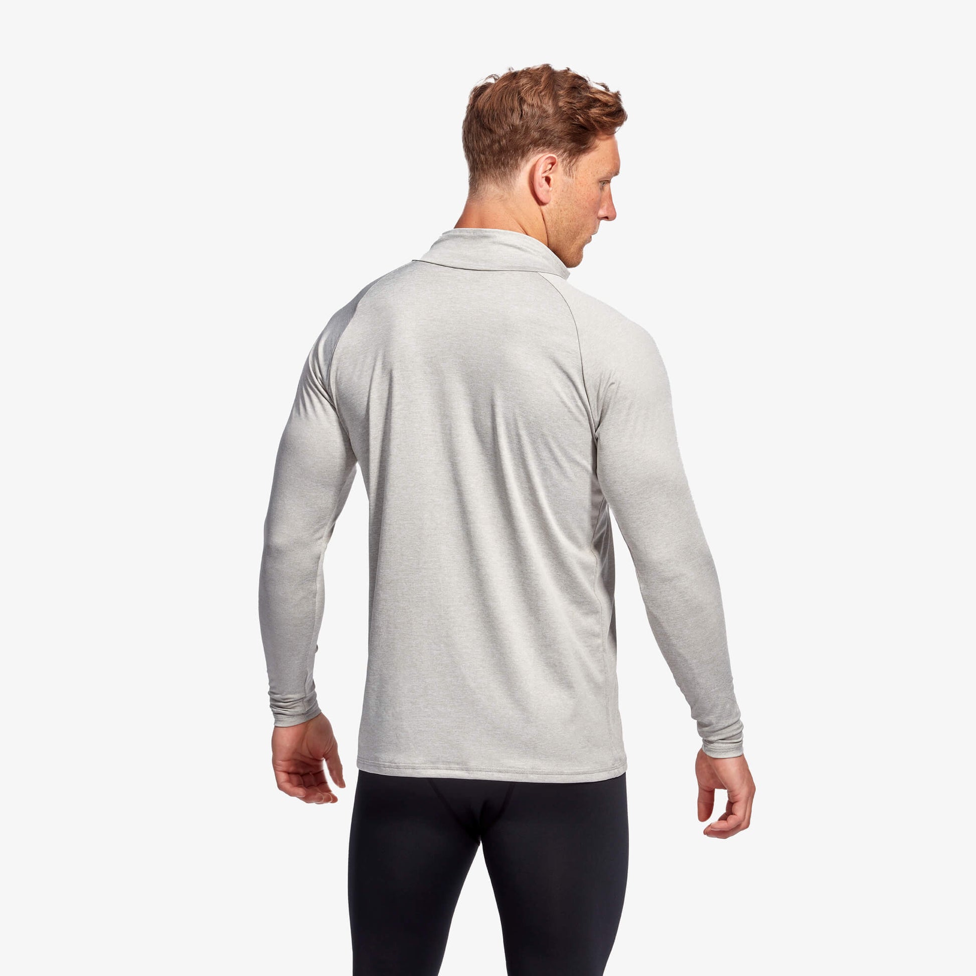 Close-up of KYMIRA Men's Infrared 1/4 Zip Long Sleeve Top detailing the high neck collar, flat-lock stitching, and structured shoulder panels for maximum comfort and mobility.