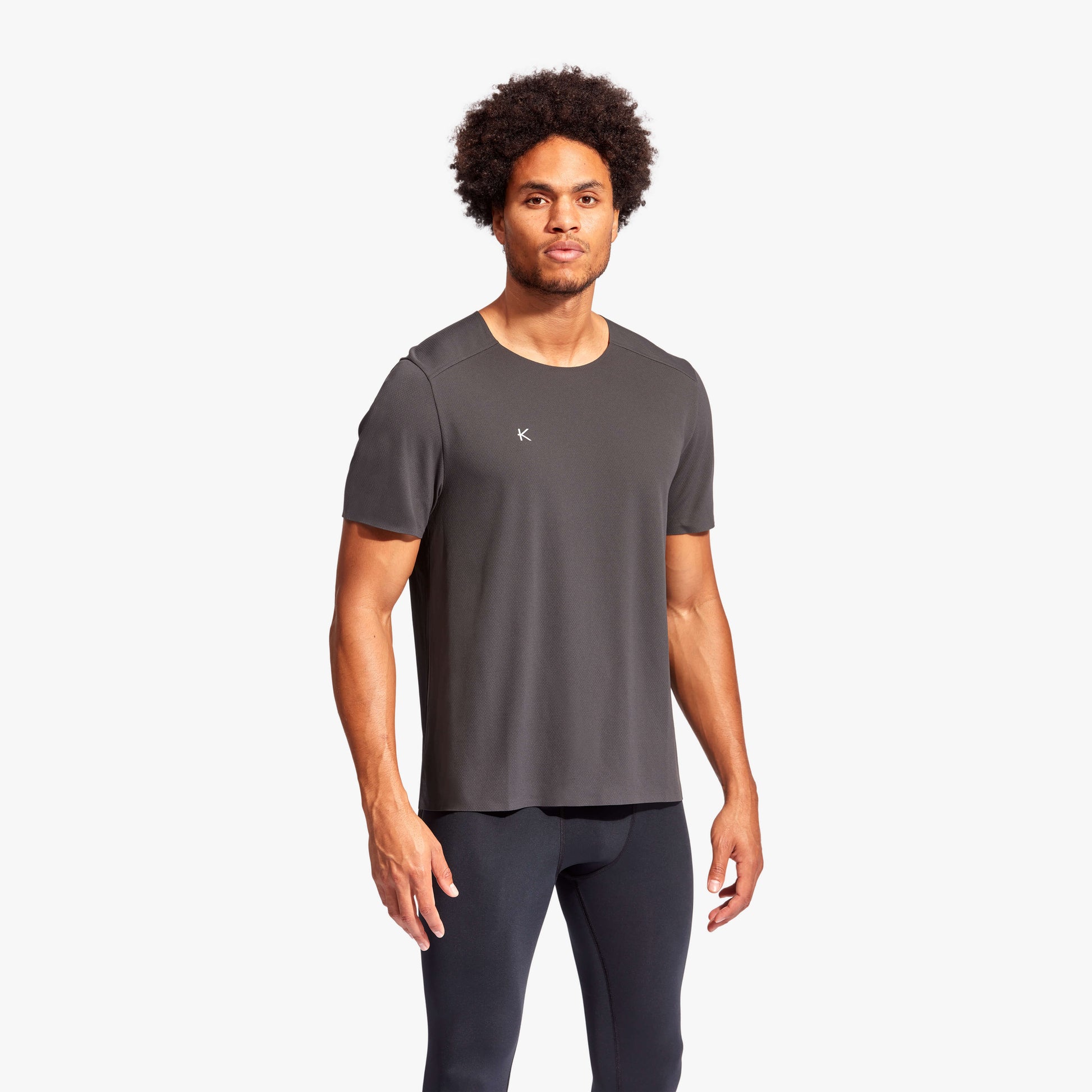 Luxurious men's KYMIRA Charge infrared performance t-shirt in lightweight, breathable fabric, showcased in a stylish presentation.