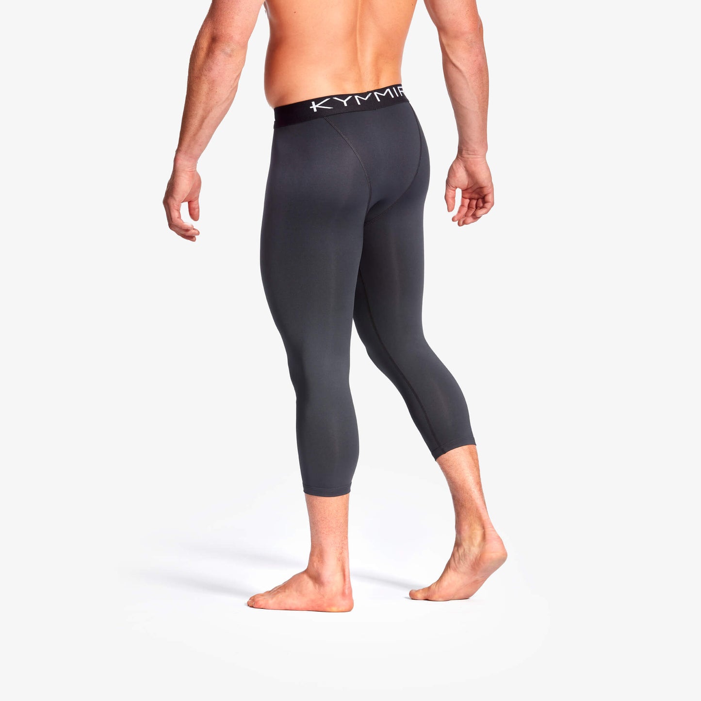 Close-up view of KYMIRA Men's Infrared 3/4 Length Leggings, showcasing the luxurious texture and seam detailing that enhance fit and flexibility.