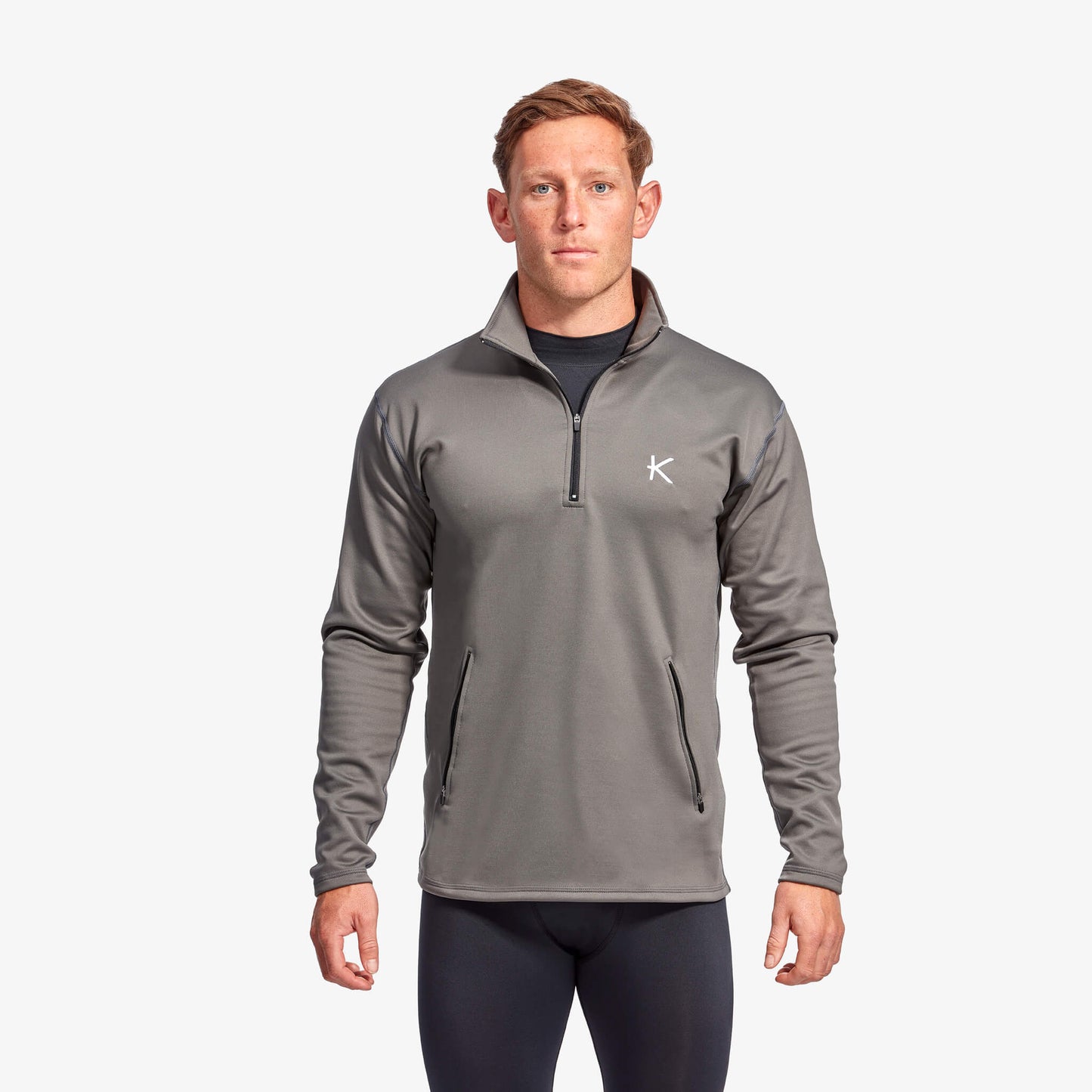 Stylish men's KYMIRA Infrared Infracycle™ Half Zip Fleece with secure zip pockets, perfect for storing essentials during exercise.