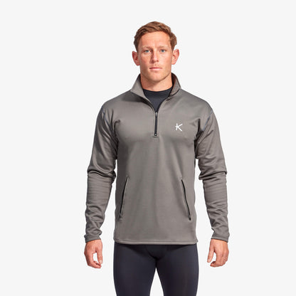 Stylish men's KYMIRA Infrared Infracycle™ Half Zip Fleece with secure zip pockets, perfect for storing essentials during exercise.