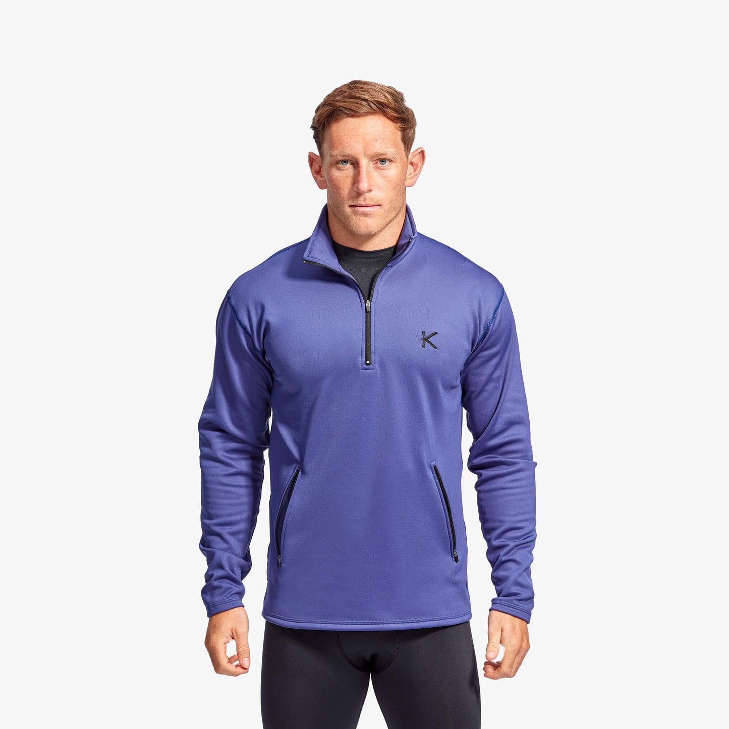 Elegant Men's KYMIRA Half Zip Fleece showcasing secure zip pockets, designed for performance and style during athletic and casual wear.