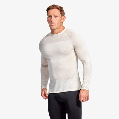 Stylish and sustainable KYMIRA men's merino baselayer top showcasing cooling zones and premium fabric technology for enhanced athletic performance.