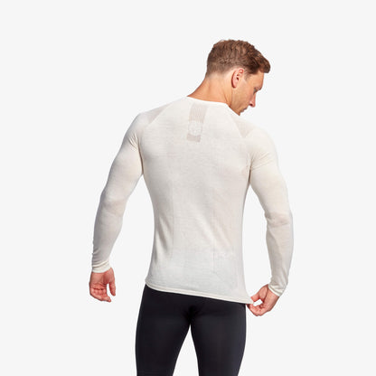 Men's Eco-Friendly Infrared Merino Baselayer Top by KYMIRA showcasing advanced thermoregulation and a luxurious seamless design, perfect for performance and comfort.