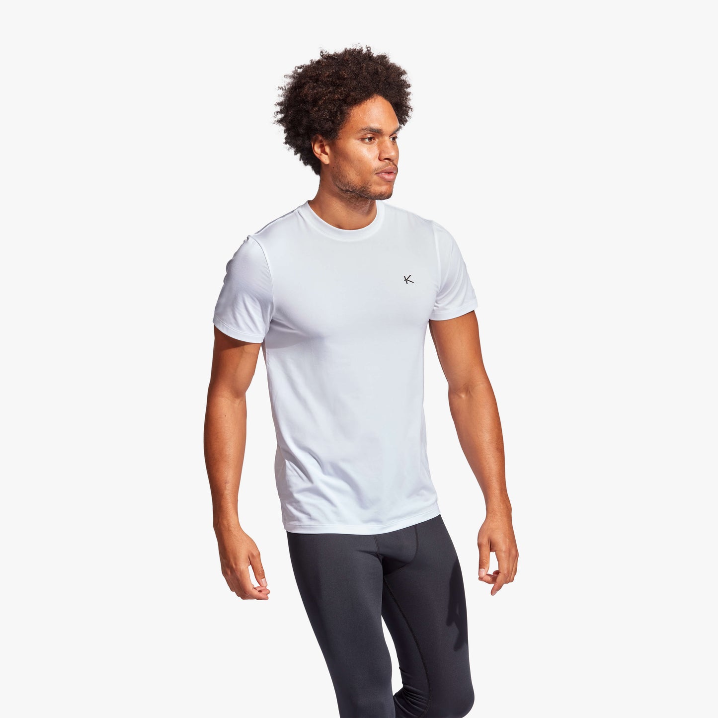 KYMIRA Men's Infrared Recovery T-Shirt showcasing sleek design and KYnergy fabric technology for superior performance and comfort in luxury sportswear.