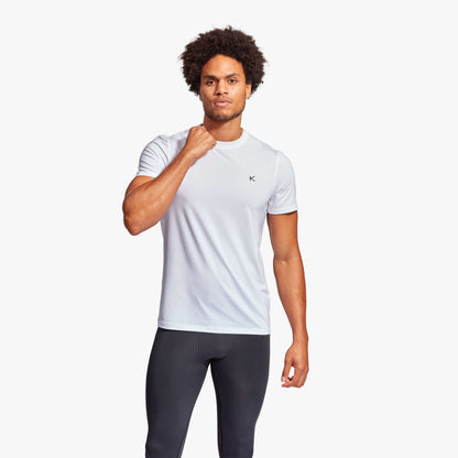 Close-up view of KYMIRA Men's Infrared Recovery T-Shirt highlighting structured panels and premium materials for enhanced upper body mobility.