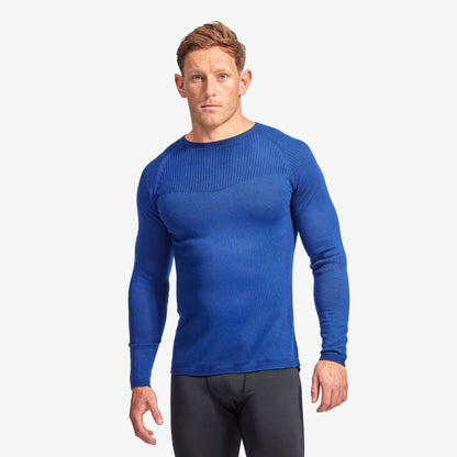 Sophisticated Men's KYMIRA Infrared Merino Wool Baselayer Top in action, highlighting the cooling zones and seamless design that provide unmatched comfort during performance.