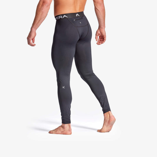 Stylish KYMIRA Men's Core Infrared Performance Leggings in black, designed for ultimate comfort and performance with a zip pocket for essentials.