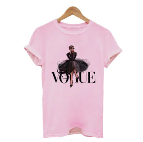 Elegant women's pink oversized T-shirt showing a sophisticated letter print design, highlighting a fashionable figure in a black tulle skirt with the word 'VOGUE' in striking lettering.