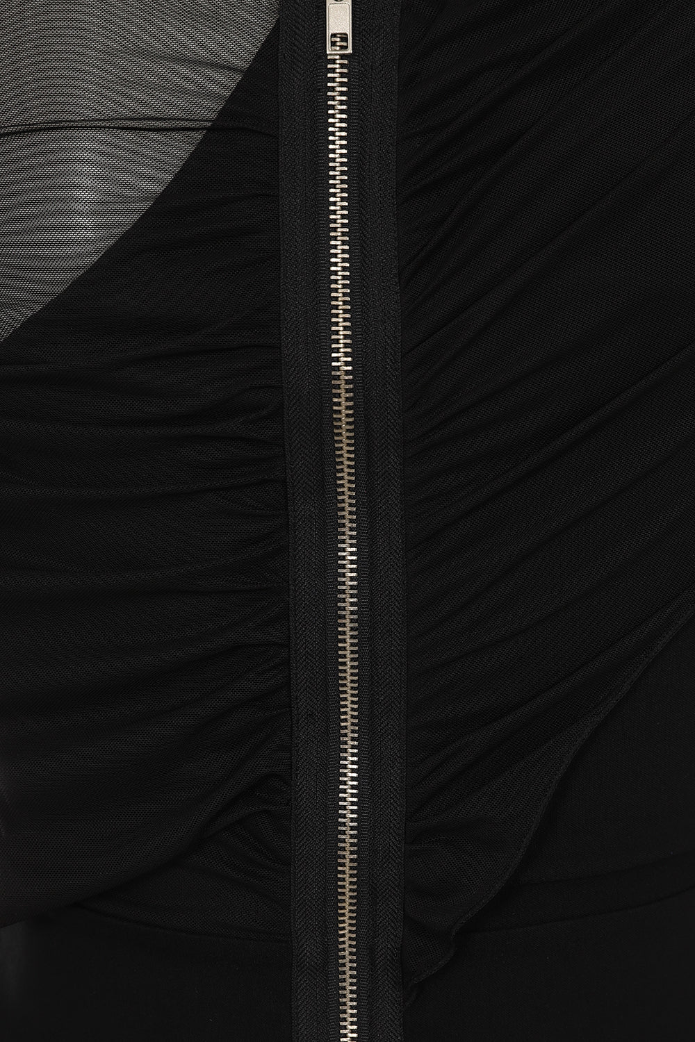 Close-up shot of the studded details on the waistband of Necessary Evil Venus Wrapped Mesh Mini Dress, highlighting the edgy craftsmanship.