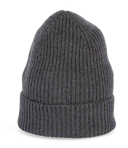 Artistic flat lay of luxurious unisex merino wool beanie with rich texture, complementing a stylish winter wardrobe.
