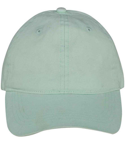 Stylish model wearing the luxury organic cotton faded cap, showcasing its versatility and one size fits most design.