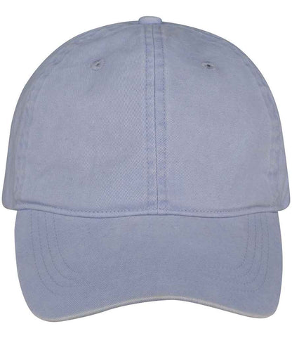 Luxury organic cotton faded cap displayed in a natural setting, emphasizing its unique faded appearance and eco-friendly materials.